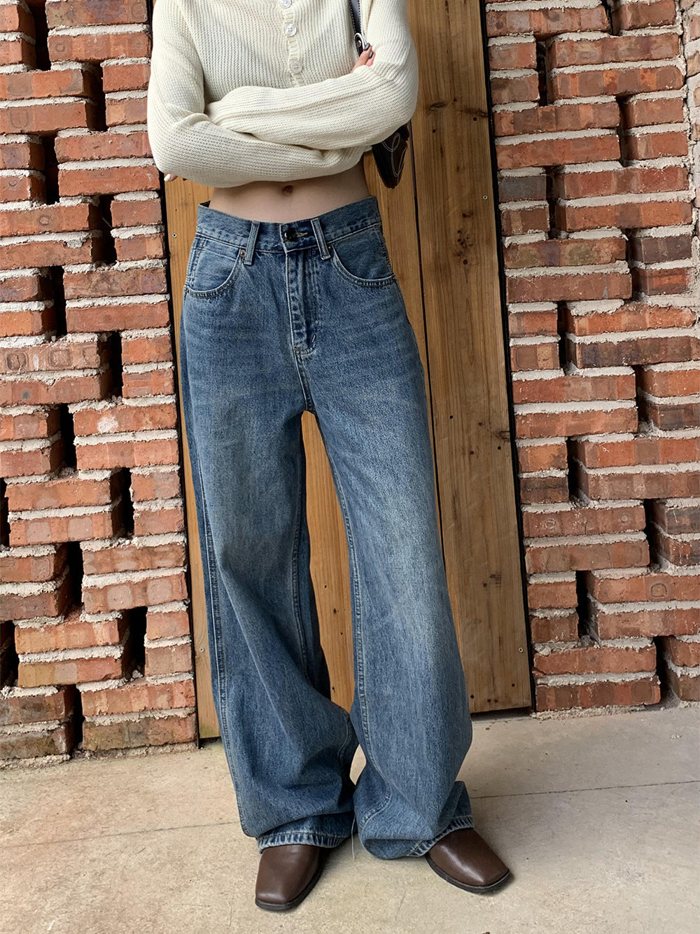 Calça de ganga de mulher de cintura alta e pernas largas 